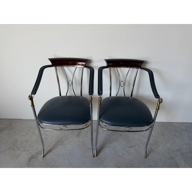 A striking pair of vintage Spanish “Swan” armchairs attributed to designer Manuel Vidal Grau, dating to the 1980s. These...