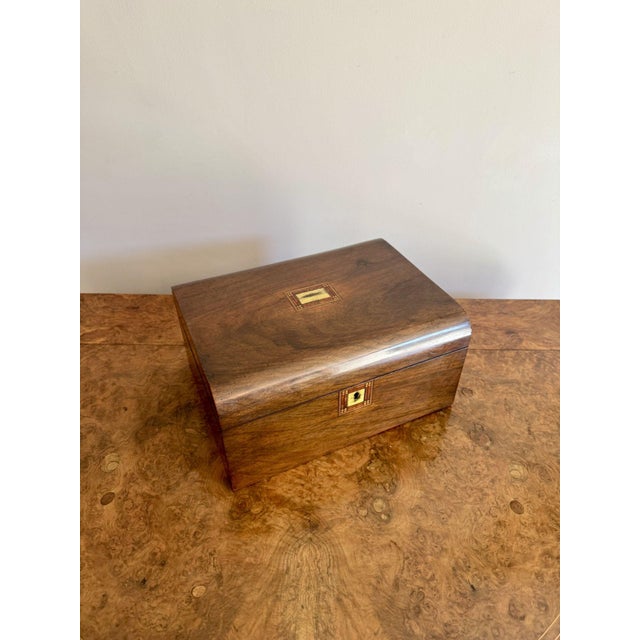 Quality antique Victorian walnut sewing box, having a quality antique Victorian sewing box with a lift up lid opening to...