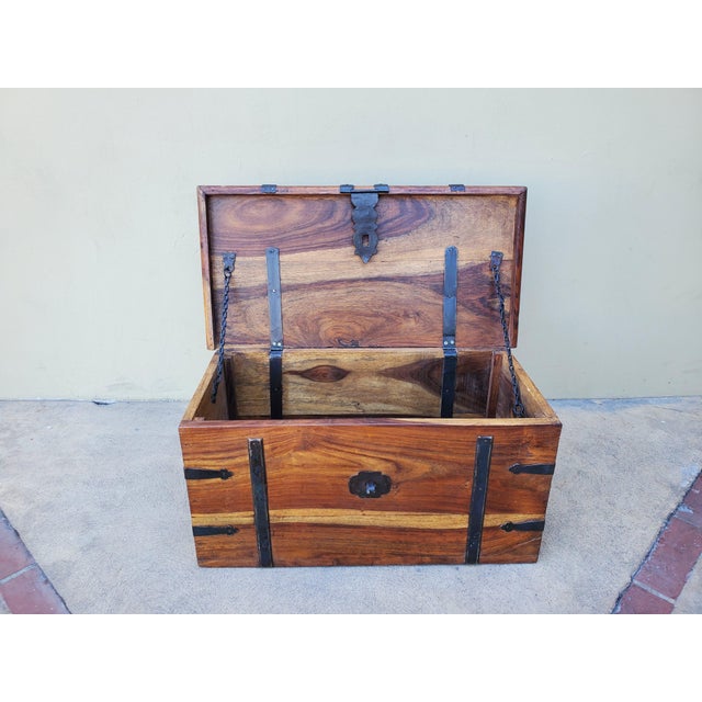 Vintage solid wood chest made in India. The chest is made out of Sheesham wood, which sometimes is called Indian Rosewood....