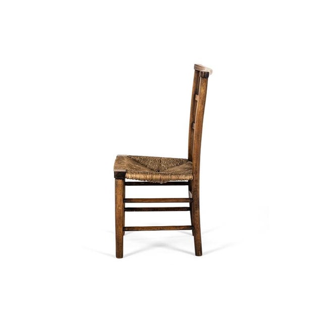 A simple late Victorian child’s chair by William Birch for Liberty of London in beech. The slightly curved lattice...