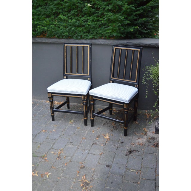 This pair of Gustavian style chairs was manufactured around 1900. They have been newly padded and reupholstered with a...