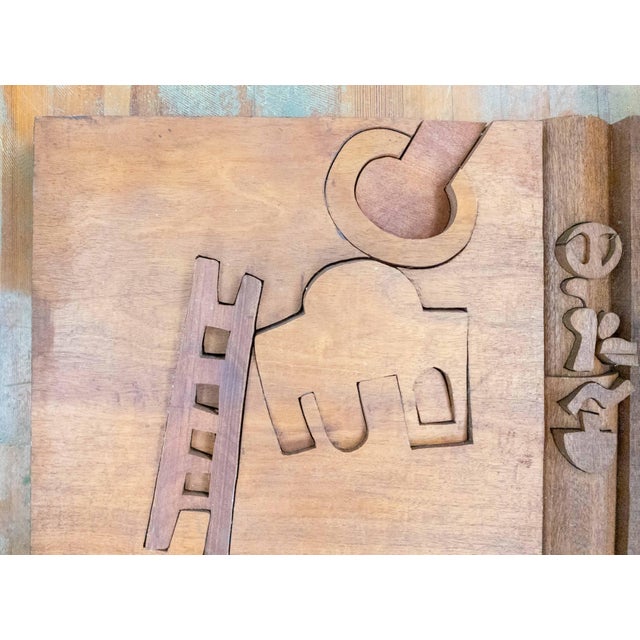 We are selling this interesting Mid-Century BAS relief wall sculpture by Hugh Townley. This dense panel features cut...