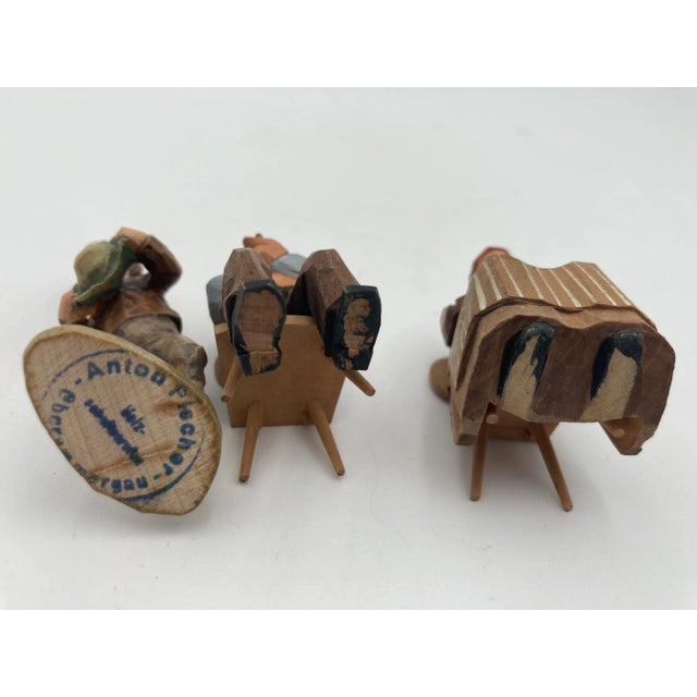 Set of 3 beautifully detailed hand carved and painted Swiss wood figurines. From an estate in North Carolina and in...
