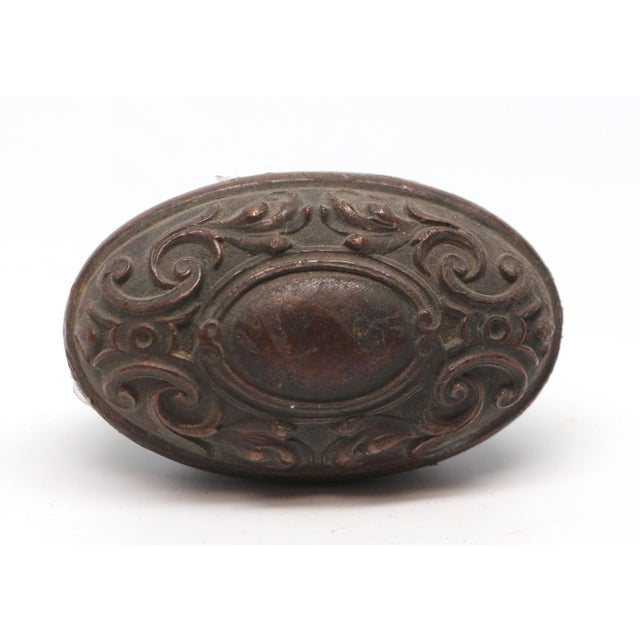 This Flemish Renaissance style oval knob was made by Yale & Towne in the 1910 catalog. It is part of the N-16500 Largo...