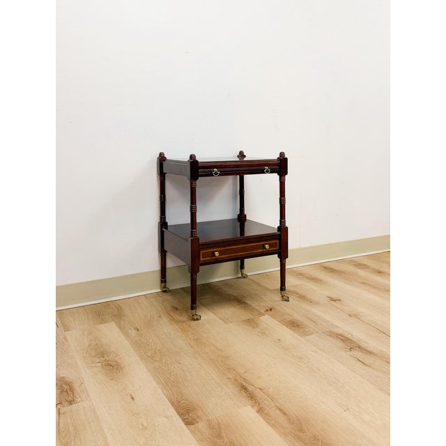 This handsome vintage mahogany traditional side table with pullout tray is a practical and classically styled accent find....