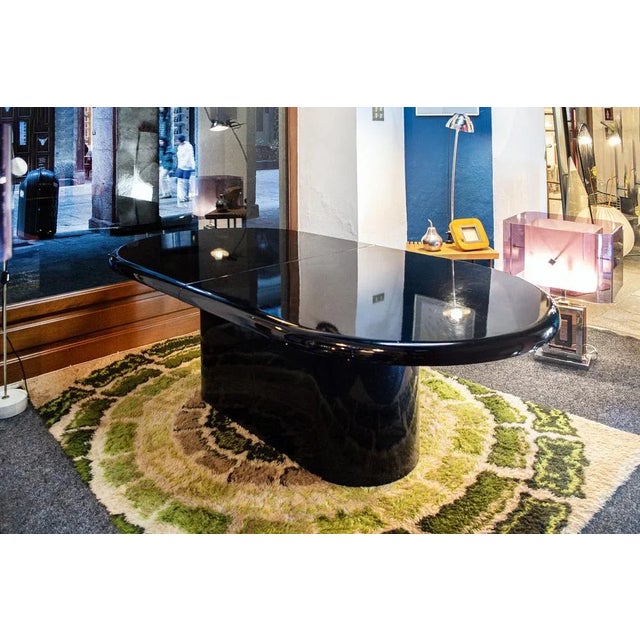 Black lacquered wooden table. Extendable. Missing extensions. Italian production 70's Size Open 265x105x74 Closed 205x105x74