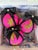 Bold leopard meets vibrant hot pink in this playful pair of handmade ornaments. Crafted from patterned cotton, the graphic...