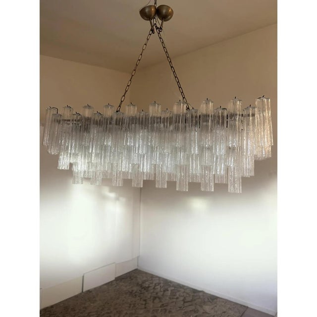 Rectangular Tronchi Murano Glass Burnished Chandelier by Simoeng, in Exhibition Piece conditions. Designed from 2000 Up to...