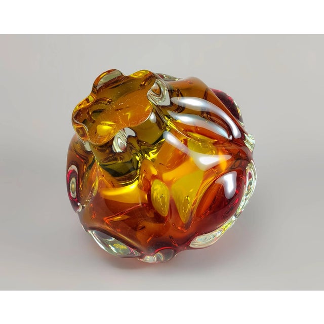 A less common pin-blown vase of bubble/globular form, with hotworked details in thick clear crystal glass over a graduated...