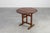A charming late‑18th‑ to early‑19th‑century French tilt‑top side table in solid oak, crafted around 1800 and embodying the...