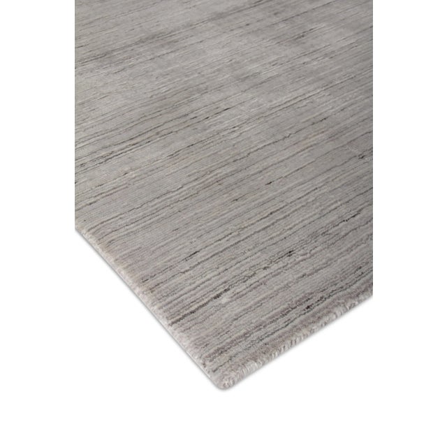 Bring a sense of harmony and balance to any setting with the Banburr Rug. The soft textured pile and beautiful linear,...