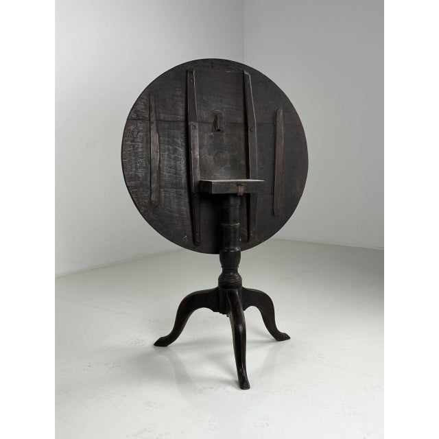 English Tilt top folding table. Originally from England. 18th century. Very dark in color, with beautiful patina....
