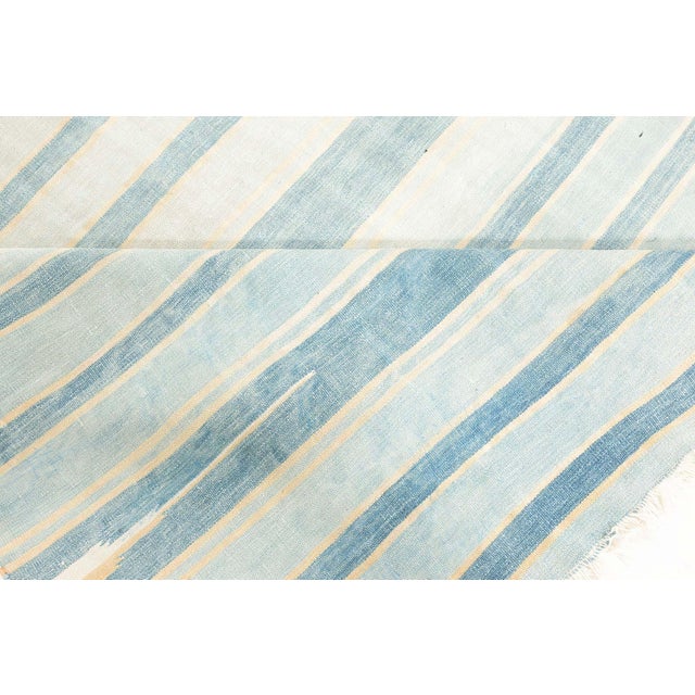 Vintage Indian Dhurrie Rug Size: 6'4" × 10'8" (193 × 325 cm) This vintage Indian Dhurrie rug, measuring 11 feet by 6 feet,...