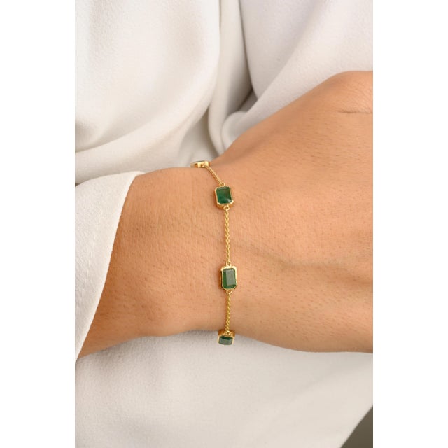 This is part of Chairish’s Fine Jewelry assortment. Adorn your wrist with the sophisticated Stackable Octagon Cut Emerald...