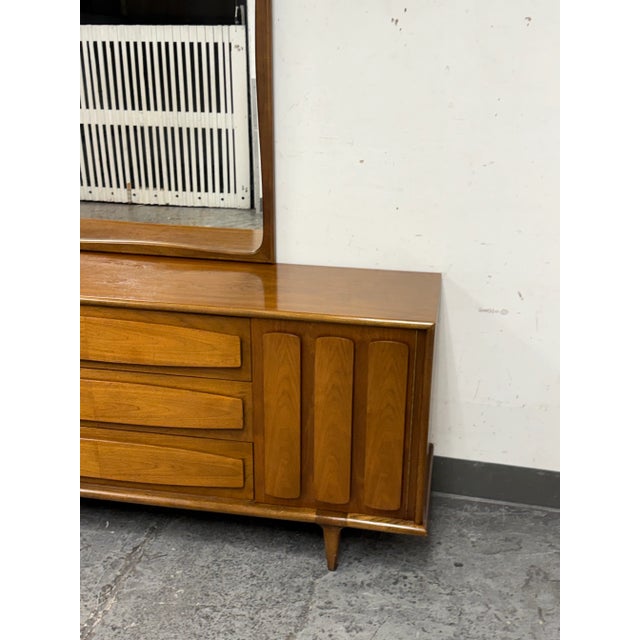 Design Plus Gallery presents a Dresser with Detachable Mirror from the Mid 20th Century by American of Martinsville. The...