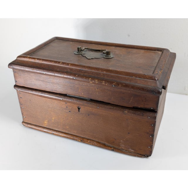 We are selling this attractive simple wood Tea Caddy or Deed box. This box has Georgian style but is probably early to mid...