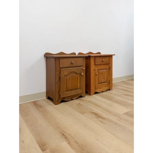 This charming pair of rustic pine nightstands are a warm and characterful European country bedroom find. Each piece...