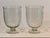 Pair of clear glass vases etched with a repeating wheat motif. Each has a rounded form that tapers to a simple circular...