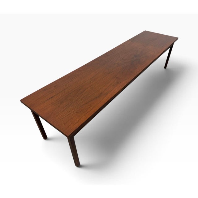 Showcase timeless 1960s design with this exceptional Mid-Century Modern Walnut Coffee Table. Featuring an impressively...