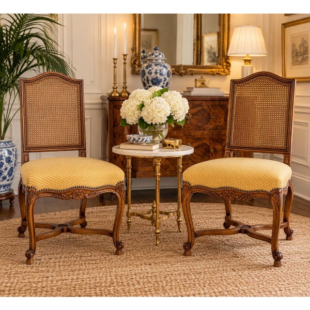 Elegant pair of vintage French Gilles Nouailhac dining or accent chairs, beautifully crafted in the Louis XV style. Each...