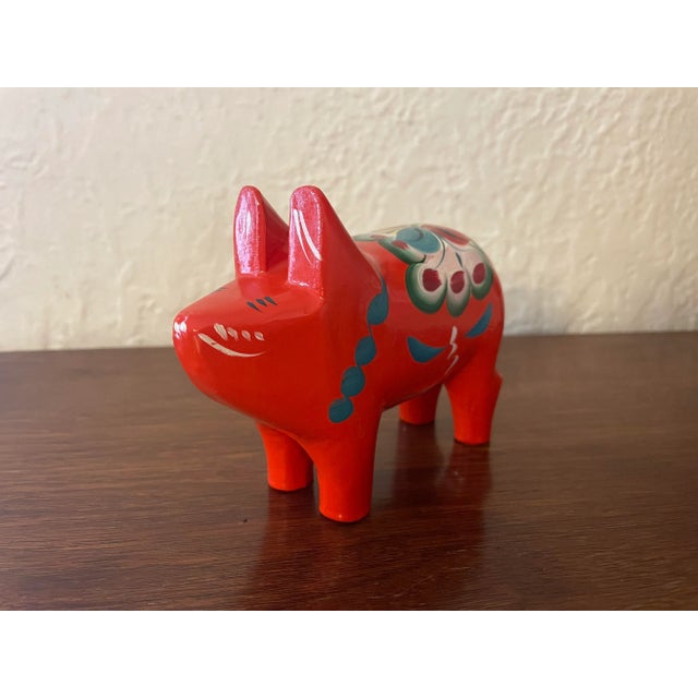 Hand-painted 1960s Swedish wooden traditional Dala pig, designed by Nils Olsson in Sweden. The Dala story began in the...