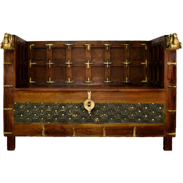 This solid wood Anglo-Indian colonial Damchiya bridal chest or day bed/bench is detailed with metal hardware. It is...