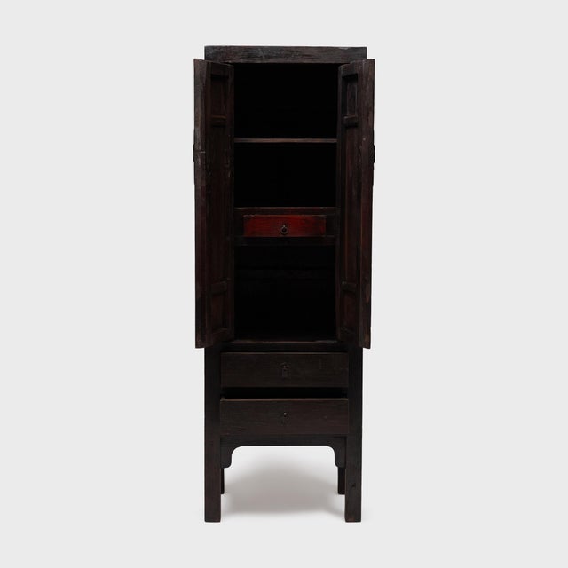 Dated to the early 20th century, this upright cabinet from northern China has a timeless and minimal design that blends...