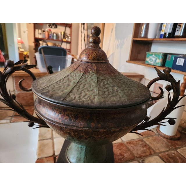 Rare and superb 19th-century urn-shaped vase with a lid, made of hammered painted iron Painted iron with a beautiful green...