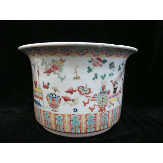 Chinese Qing Dynasty, late 19th century porcelain jardiniere. Hand painted enamel on white porcelain, decorated with...