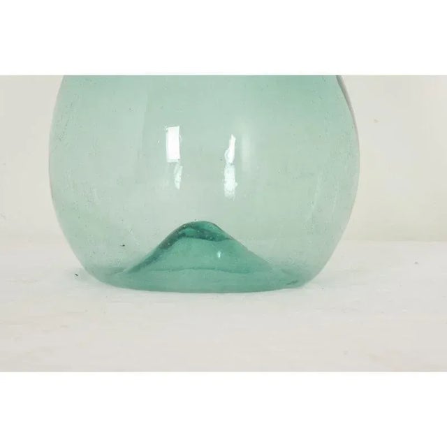Dimensions: 19 ⅝” H x 9 ⅞” D A rare Italian blown glass damigiana or demijohn hand-crafted in Italy circa 1800. Handmade...