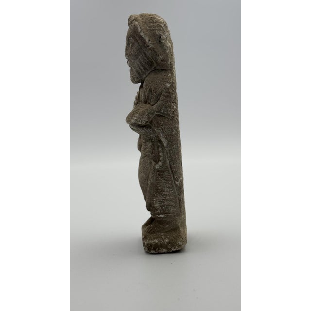 This finely crafted figure of Saint James, likely molded from reconstituted stone, presents the apostle in a standing...