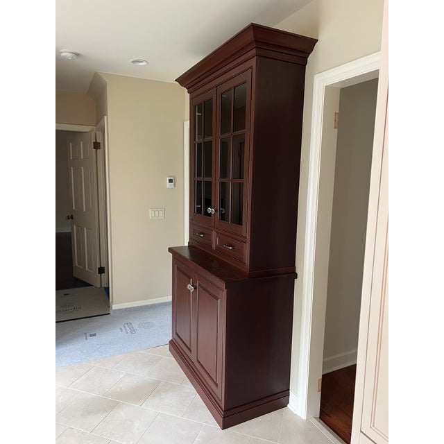 This large kitchen breakfront cabinet was made to order for an updated but traditional kitchen. It is made of solid wood...
