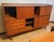 Beautiful Highboard, Sideboard, High teak sideboard from the 1960s. Large piece of furniture but with light and essential...