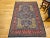 This vintage Persian Tabriz rug from the early 20th century showcases an exquisite allover floral pattern on a deep navy...