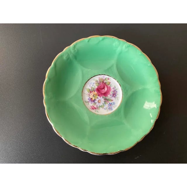 A beautiful green and rose dish vide-poche catchall with Victorian floral design by famous English porcelain maker,...