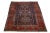 This beautiful vintage Karajah hand-knotted wool rug features a navy blue field with multi-color accents in a stunning...