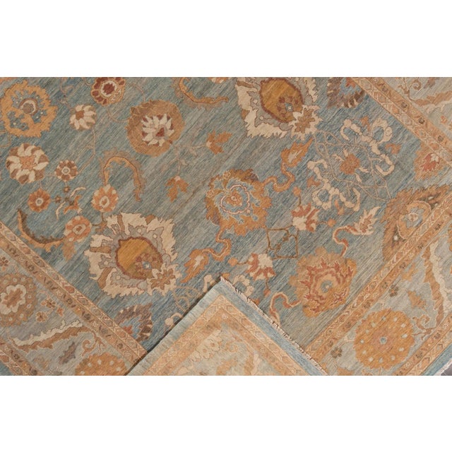 This modern reinterpretation of timeless Sultanabad design is beautifully manifested in a hand-knotted wool rug,...