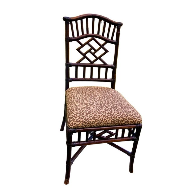 A stunning example of the quintessential Tommy Bahama aesthetic, this vintage Chinese Chippendale-style bamboo side chair...