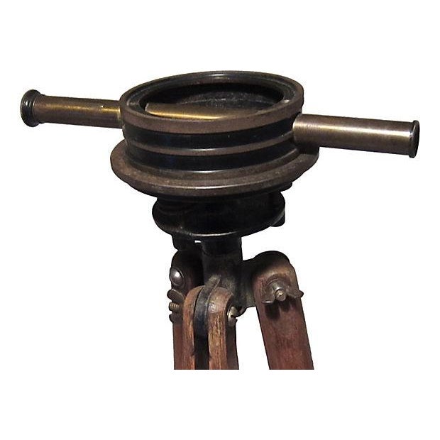 An antique transit by the Bostrom Level Manufacturing Company on original oak tripod. A great piece for display with...