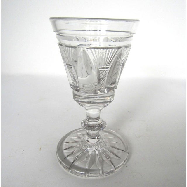 Set of six antique English or Anglo-Irish cut crystal wine glasses, circa 1830, featuring flared trumpet-form bowls with...