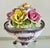 Bring classic Italian elegance to your home with this beautiful vintage Capodimonte porcelain floral centerpiece....