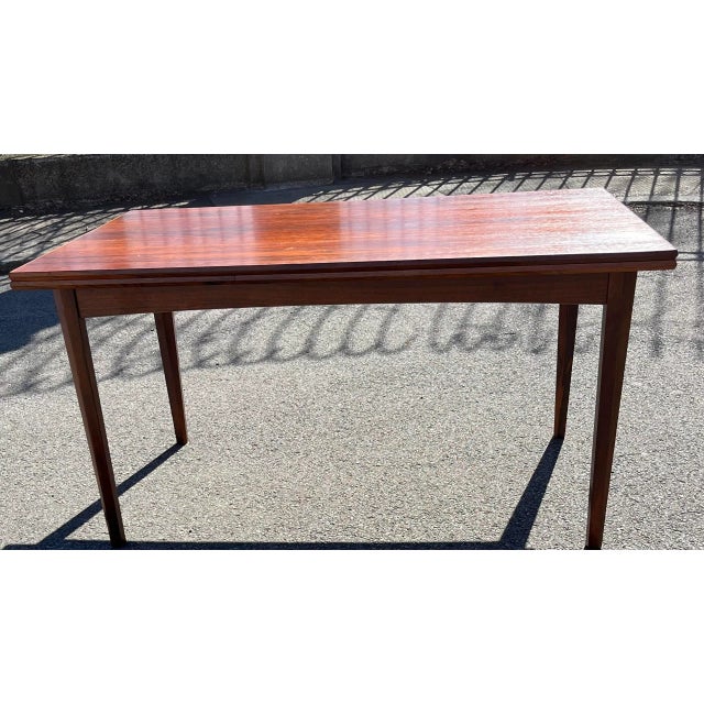 Rosewood mid-century modern draw-leaf dining table