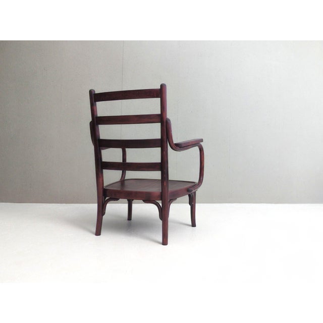 Designed by josef frank in the late 1920s and produced by thonet, the a 403/f armchair reflects a unique synthesis of...