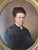 Skillful and elegant mid-19th century oil painting of a woman in black with a cameo. Original and one of a kind. The...