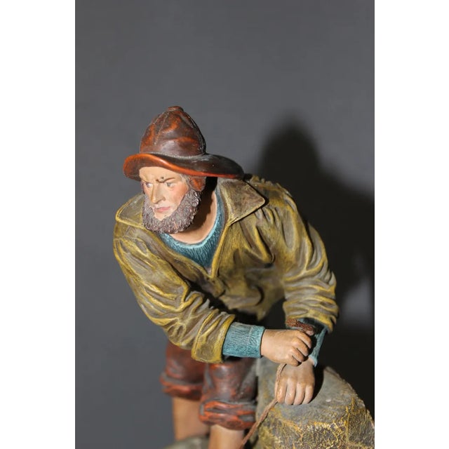 Polychrome terracotta representing a Breton fisherman titled "4 days nothing" Brest and signed on the back Tilge, original...