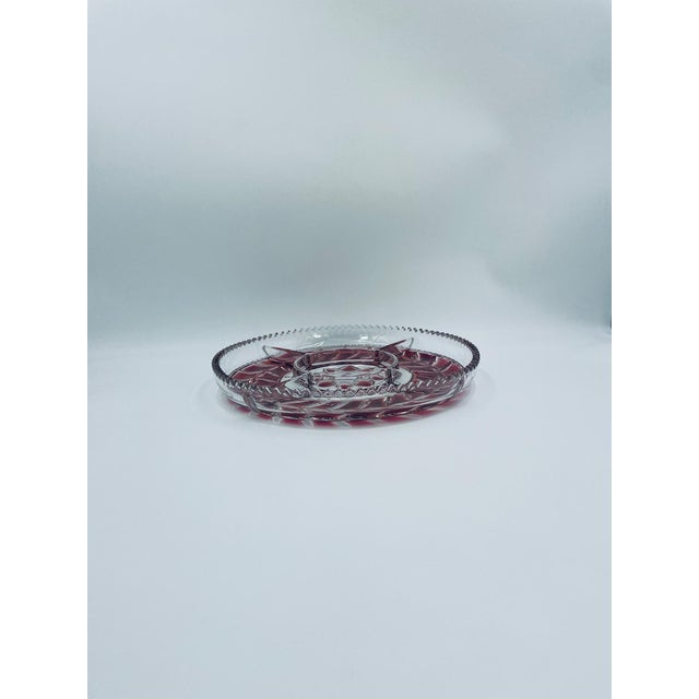 A snack platter from the 1970s, dating back to the communist era, made of high-quality pressed glass. This round,...
