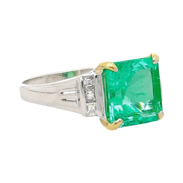 This vintage platinum ring features a GIA Certified Colombian 2.91 carat Colombian emerald with a square emerald cut,...