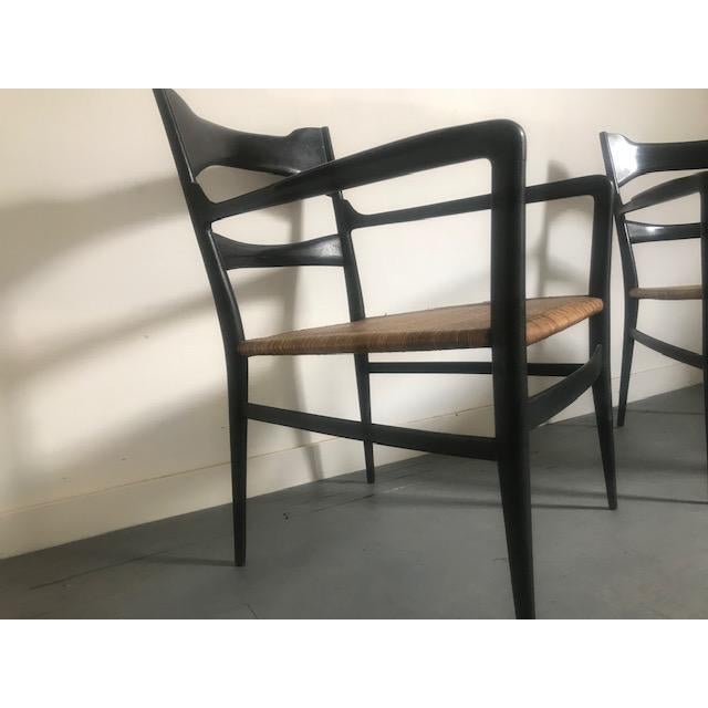 Italian 1960's Chairs From Gio Ponti's Manufacturing Company Vintage. Good Condition. Black ebonized wood and ratan.