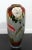 A stunning vintage vase that is made with enameled cloisonne. The design is depicting a lovely koi fish imagery. In...
