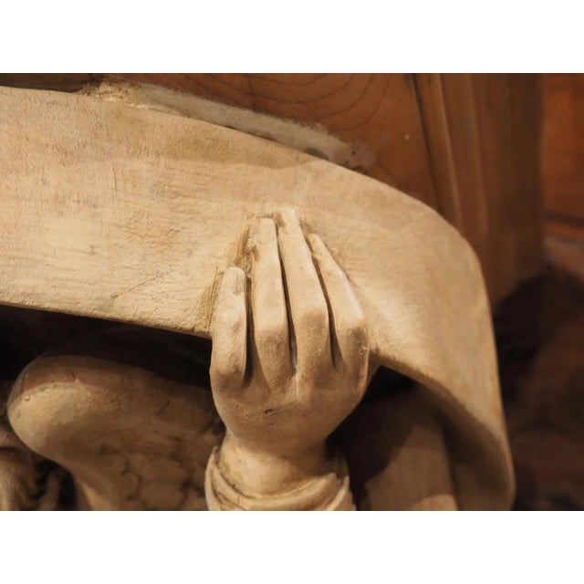 Hand-carved in France, circa 1880, this wooden bracket console features a wonderfully executed winged angel beneath an...